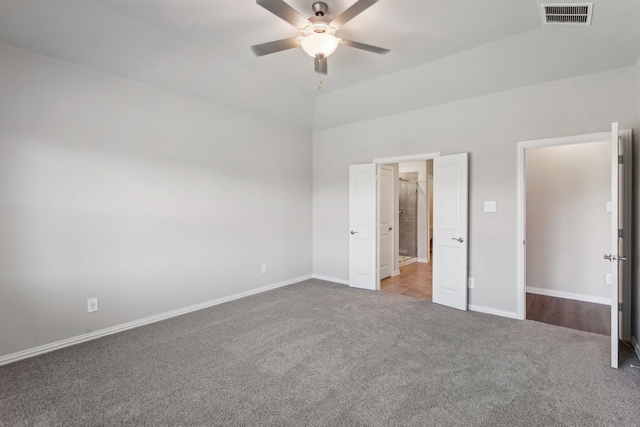 unfurnished bedroom featuring carpet floors, visible vents, ceiling fan, and baseboards