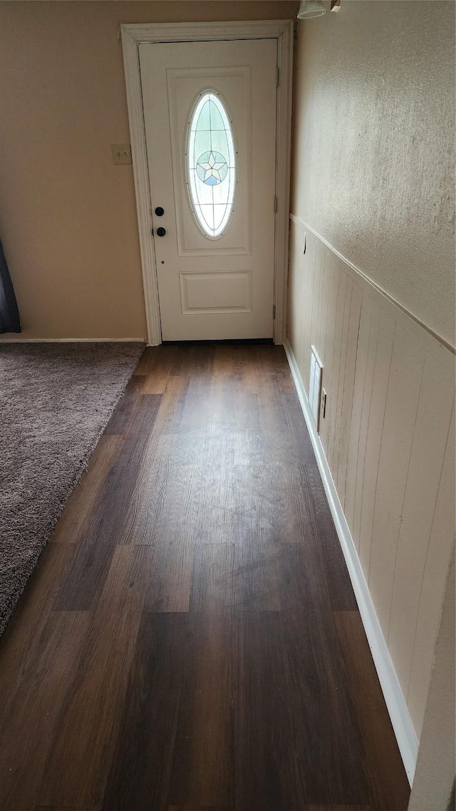 entryway featuring wainscoting and wood finished floors