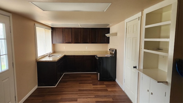 437 W Grenoble Dr, Grand Prairie, TX 75052 - kitchen with a sink, range with electric cooktop, dark brown cabinets, and dark wood-type flooring