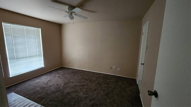 437 W Grenoble Dr, Grand Prairie, TX 75052 - empty room with ceiling fan and dark colored carpet