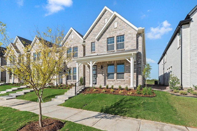 view of front of property with brick siding and a front yard