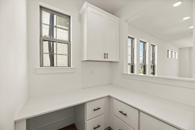 unfurnished office featuring recessed lighting and built in study area