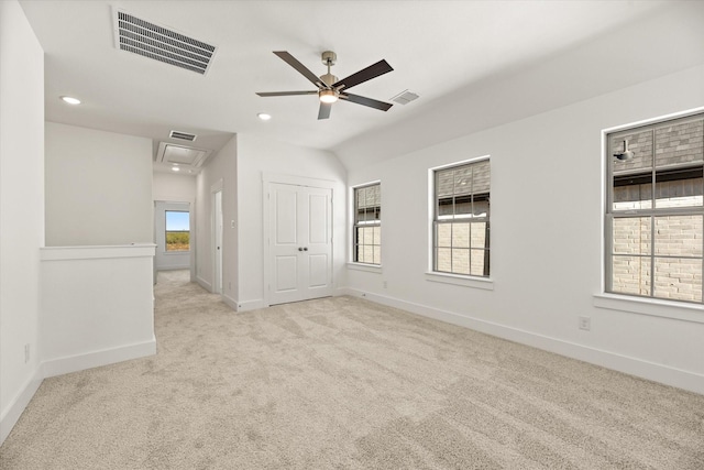 spare room with recessed lighting, carpet, visible vents, and baseboards