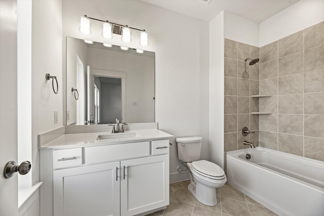 bathroom featuring toilet, vanity, baseboards, tile patterned floors, and washtub / shower combination