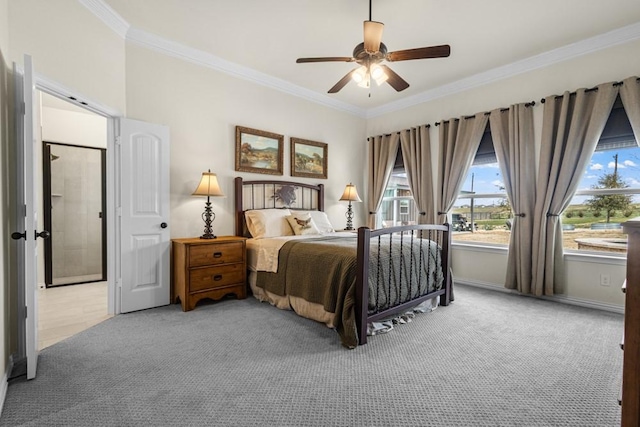 carpeted bedroom featuring a ceiling fan, crown molding, and baseboards