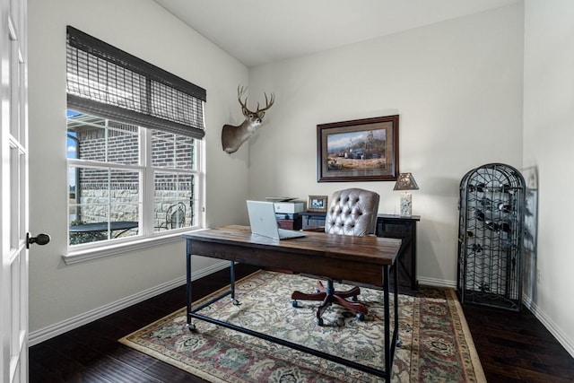 office space featuring hardwood / wood-style flooring and baseboards