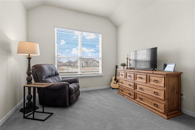 sitting room with vaulted ceiling, carpet floors, and baseboards