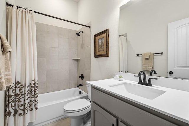 bathroom featuring shower / tub combo, vanity, toilet, and tile patterned floors