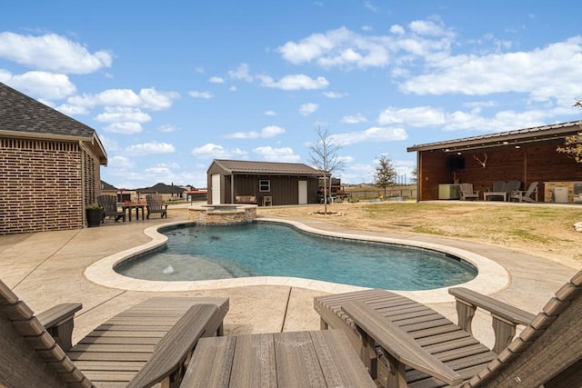 view of pool featuring an outbuilding, a patio, an exterior structure, and a pool with connected hot tub