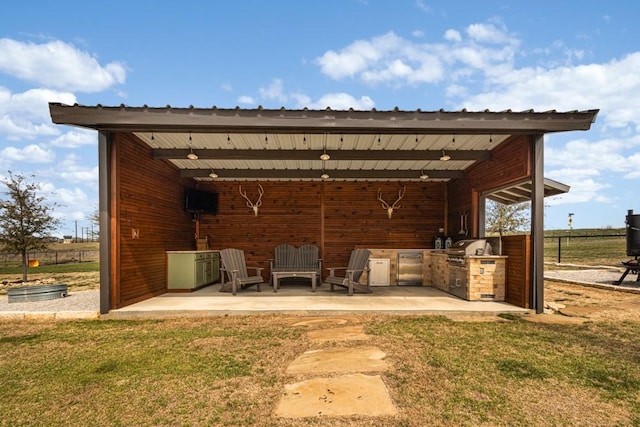 view of patio / terrace featuring exterior kitchen and area for grilling