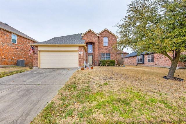 traditional home featuring central AC unit, an attached garage, brick siding, driveway, and a front lawn