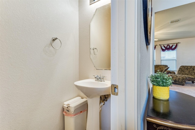 bathroom featuring a sink and visible vents