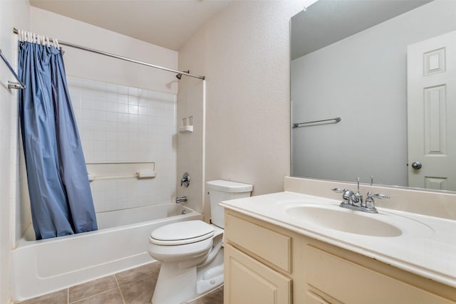 full bathroom with shower / tub combo with curtain, vanity, toilet, and tile patterned floors