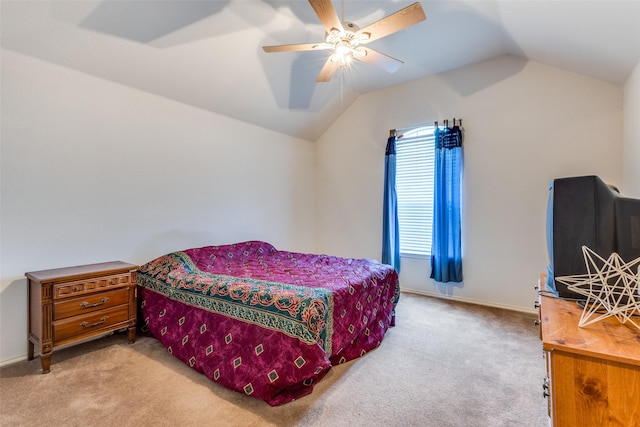 bedroom featuring lofted ceiling, baseboards, a ceiling fan, and light colored carpet