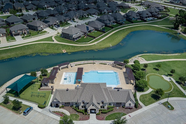 bird's eye view featuring a water view and a residential view