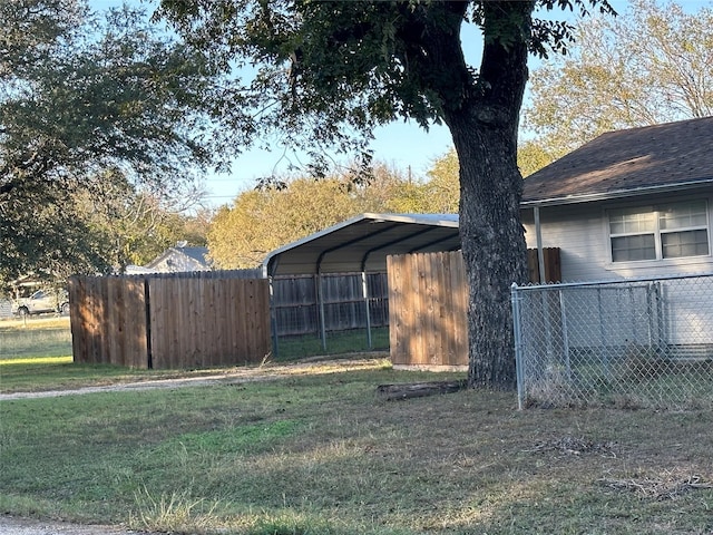 exterior space featuring fence and a carport