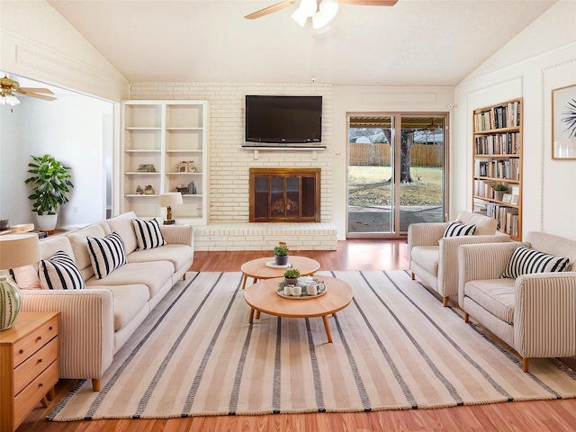 carpeted living area featuring a ceiling fan, baseboards, visible vents, and crown molding