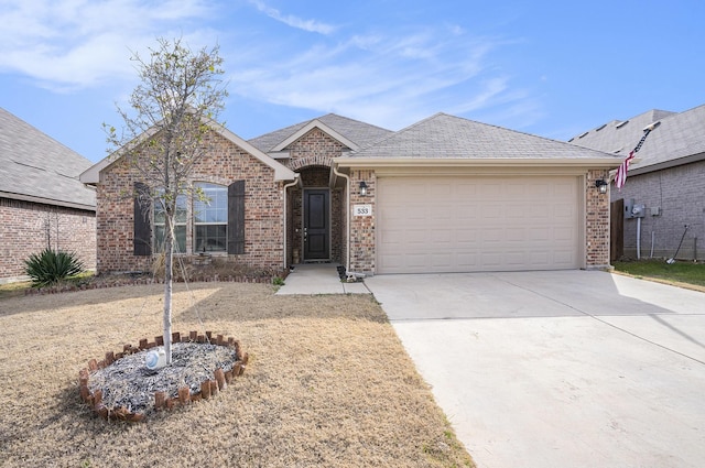 ranch-style home featuring a garage, concrete driveway, brick siding, and a shingled roof