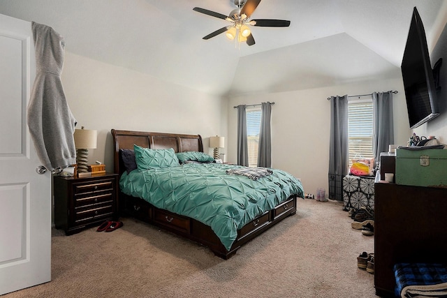 bedroom with lofted ceiling, carpet floors, multiple windows, and a ceiling fan