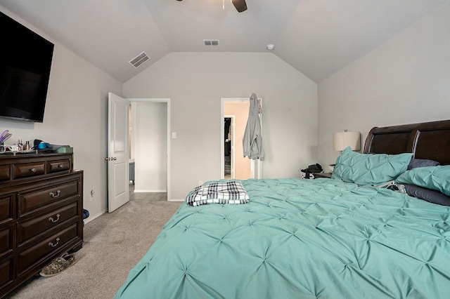 bedroom featuring light carpet, lofted ceiling, visible vents, and a ceiling fan