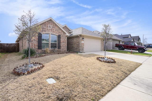 single story home featuring an attached garage, brick siding, a shingled roof, fence, and driveway