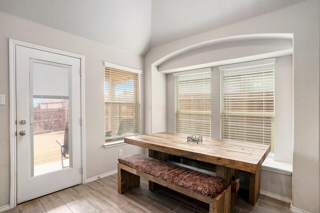 dining space with wood finish floors and baseboards