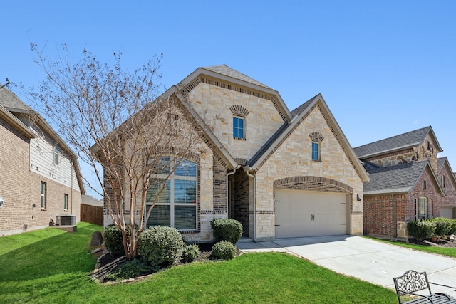 french provincial home featuring central air condition unit, stone siding, driveway, and a front yard