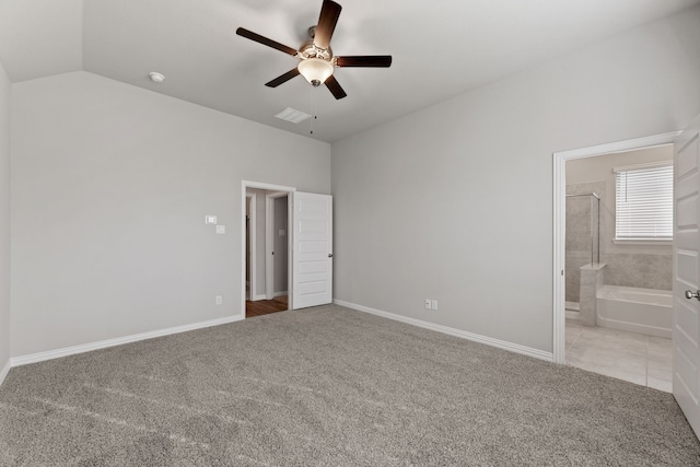 unfurnished bedroom with ceiling fan, lofted ceiling, light carpet, baseboards, and ensuite bath