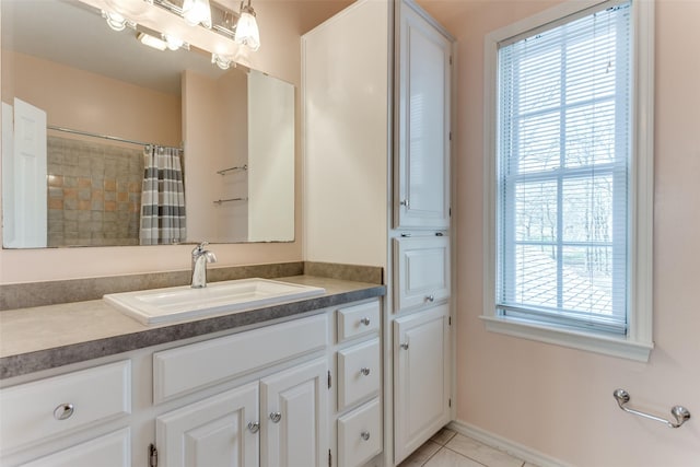 full bathroom with tile patterned flooring, curtained shower, and vanity