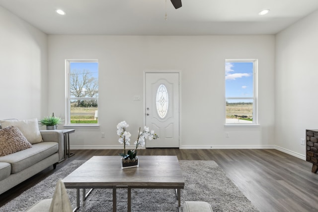 living room with baseboards, dark wood-style flooring, and recessed lighting