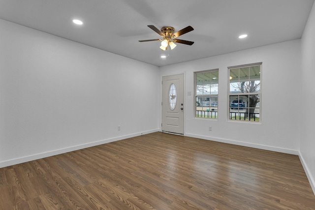 entryway with baseboards, dark wood-style flooring, and recessed lighting