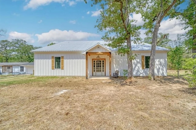 view of front of home with board and batten siding and metal roof