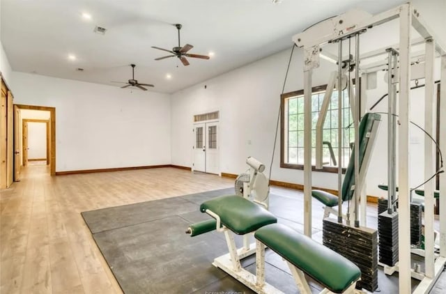 workout area featuring recessed lighting, baseboards, visible vents, and light wood finished floors