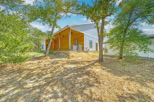 back of house with ceiling fan