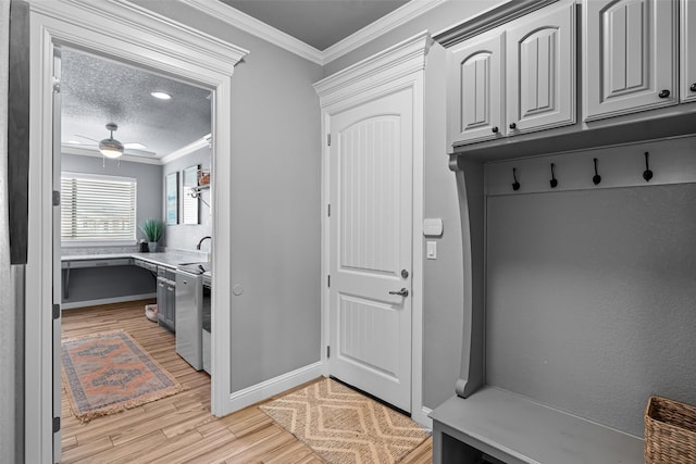 mudroom featuring ceiling fan, ornamental molding, a textured ceiling, light wood-style floors, and a sink