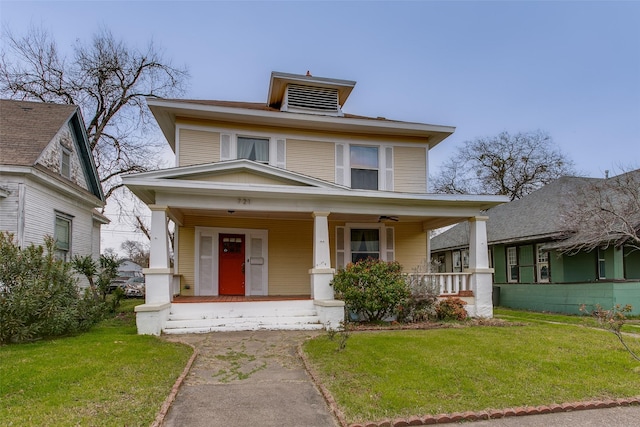 traditional style home featuring a porch and a front yard