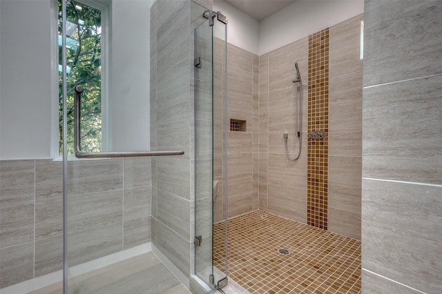 full bath with a shower stall