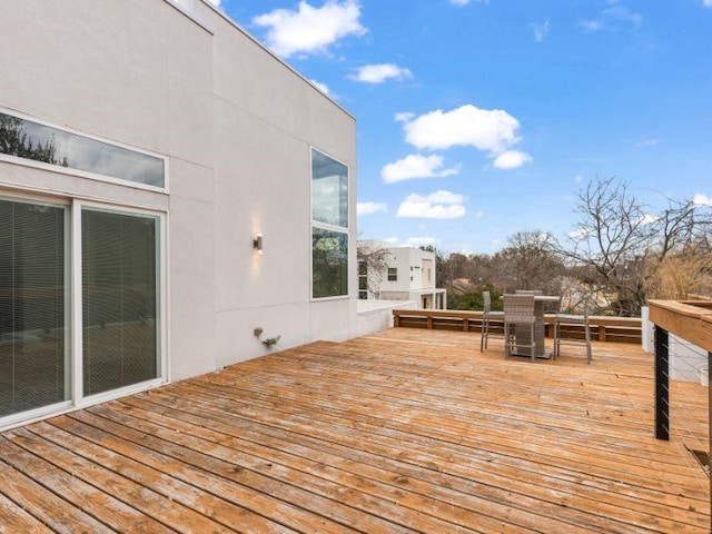 wooden deck with outdoor dining space