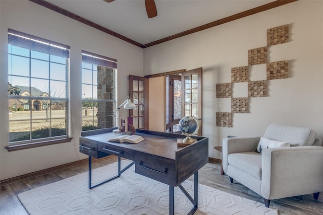 office space featuring ceiling fan, ornamental molding, light wood-style flooring, and baseboards