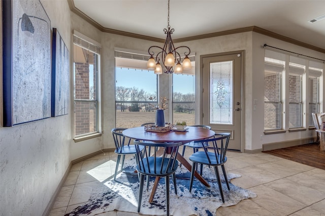 dining area with visible vents, baseboards, a textured wall, crown molding, and a notable chandelier