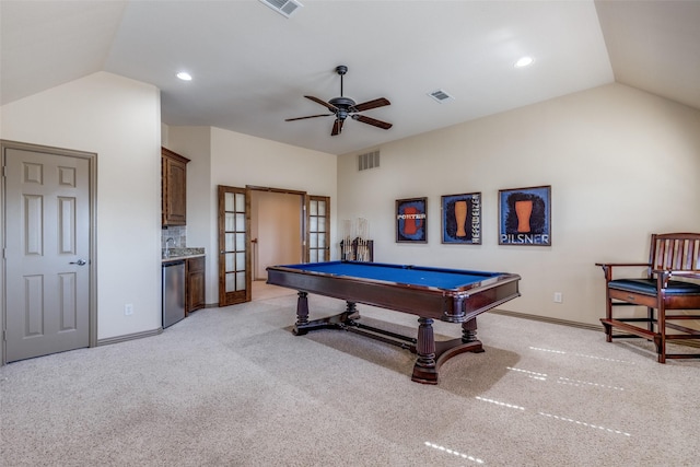 rec room with lofted ceiling, light carpet, visible vents, and a ceiling fan