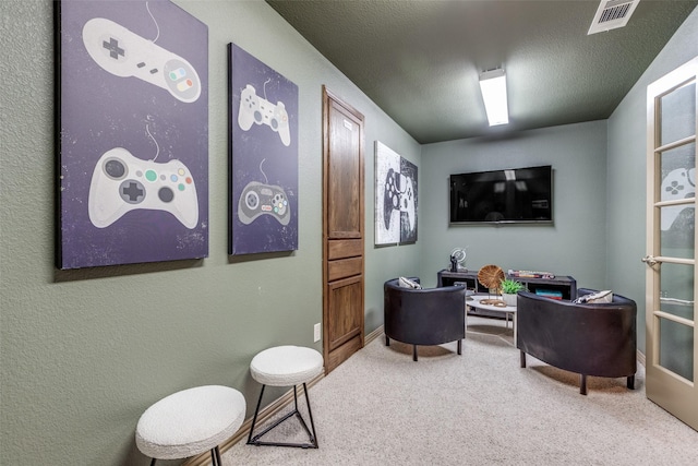 interior space with visible vents and a textured ceiling