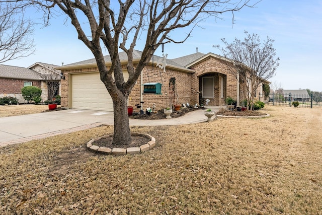 single story home featuring an attached garage, fence, concrete driveway, and brick siding