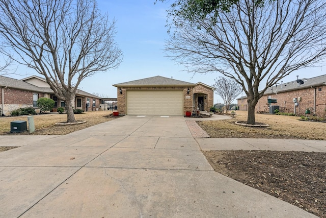 view of front of home featuring a shingled roof, brick siding, driveway, and an attached garage