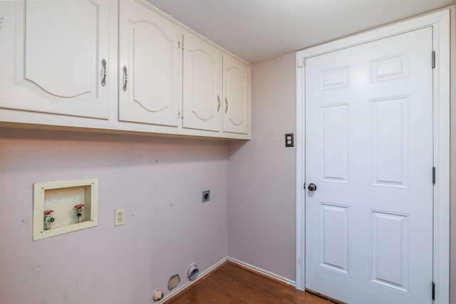 laundry room featuring cabinet space, hookup for a gas dryer, dark wood-style flooring, hookup for a washing machine, and hookup for an electric dryer