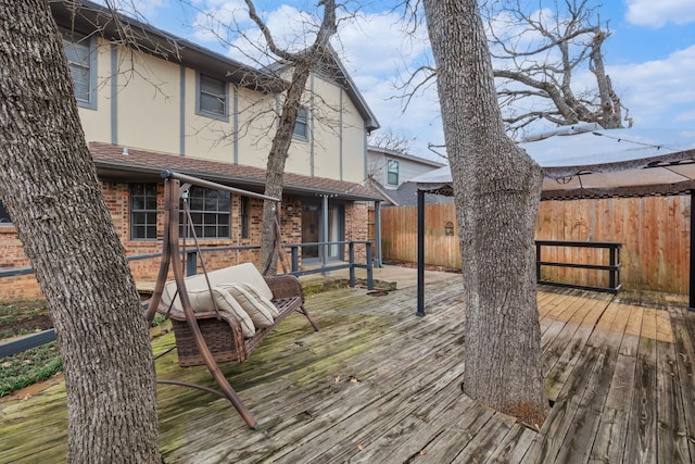 wooden deck featuring fence