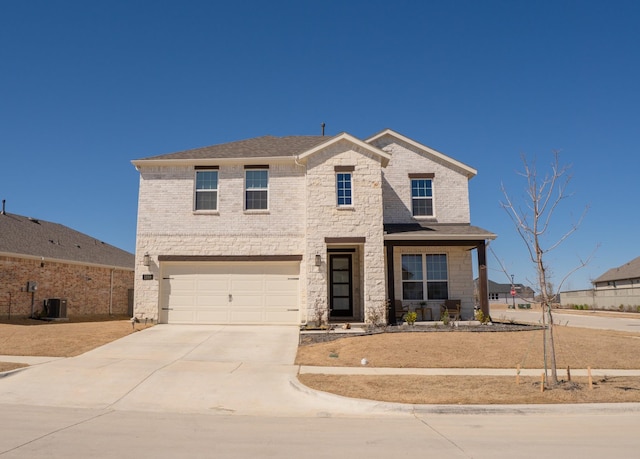 view of front of house featuring driveway, a shingled roof, an attached garage, central air condition unit, and brick siding