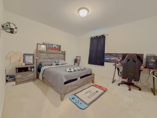 bedroom featuring carpet flooring and baseboards