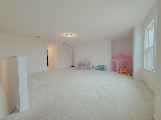 recreation room with carpet flooring and visible vents