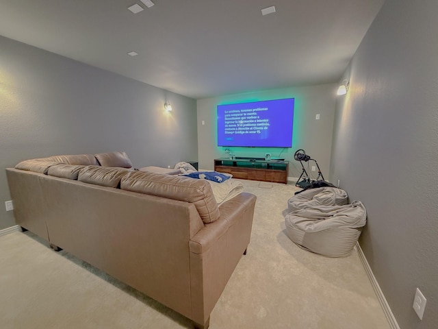 carpeted home theater with baseboards